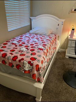 white twin bed frame and mattress