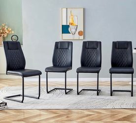 Set of 4 New in Box (Never opened) Modern Chairs with PU Faux Leather Padded Seat and Metal Legs.
