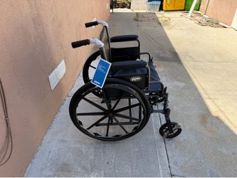 20 inches wide wheelchair in excellent condition  with footrest  easy to fold