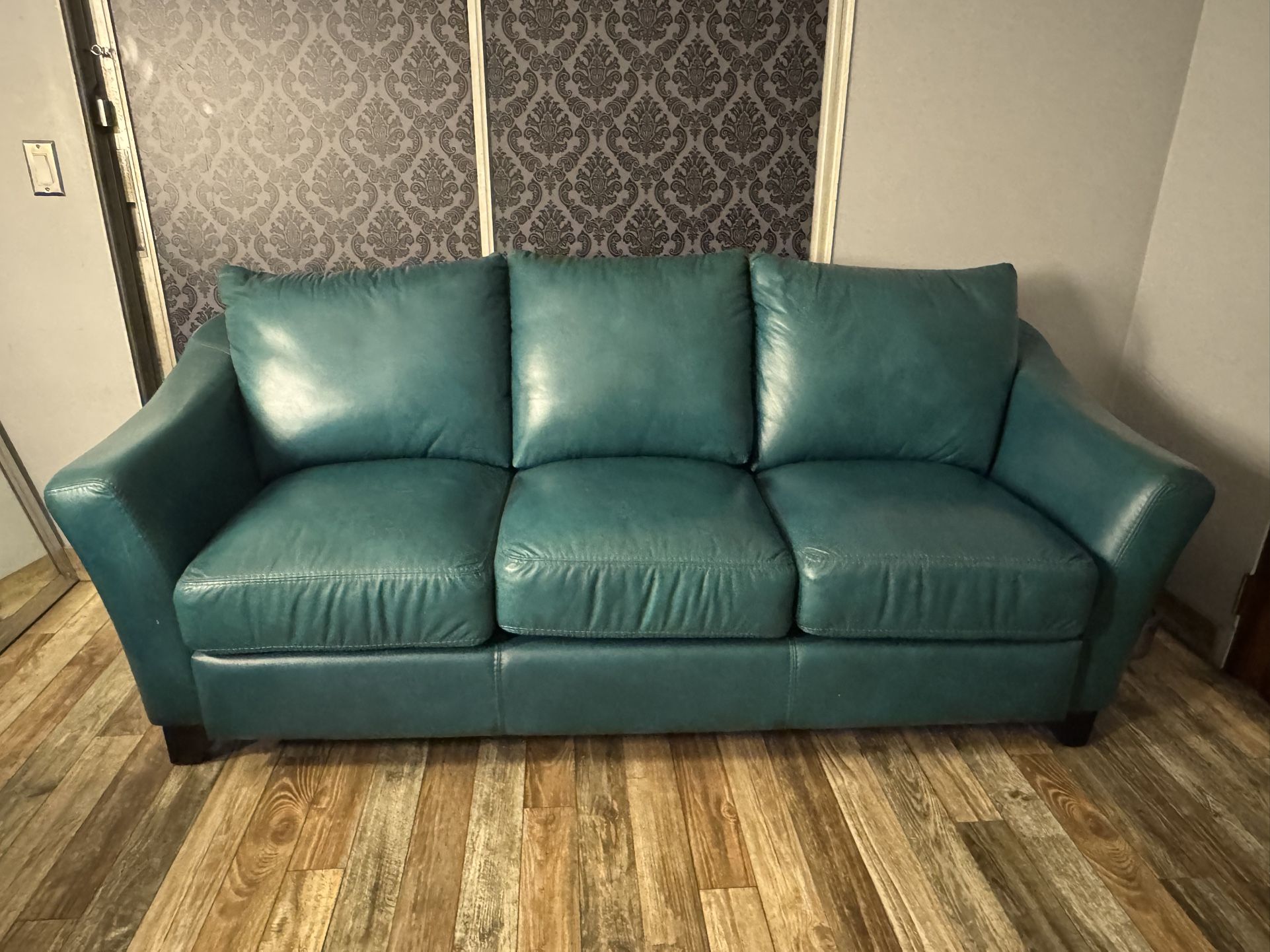 Teal leather 3-seater couch- $200