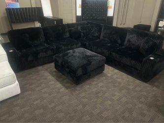 Extra large deep and comfy black sectional and ottoman