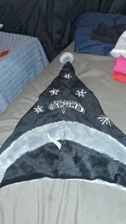 Black and grey colored spurs beanie, one size fits most.