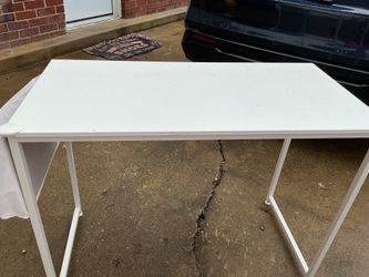A white desk 38” long x 19” wide x 30” tall