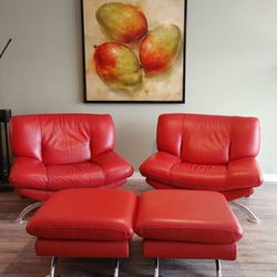 PAIR OF ITALIAN POSTMODERN MUTED RED LEATHER ARMCHAIRS AND OTTOMANS

