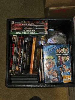 Crate full of miscellaneous CD's, DVD's & Games