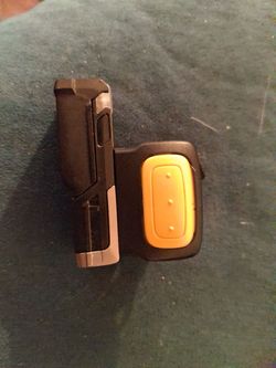 wearable barcode scanner is a black Zebra RS5100