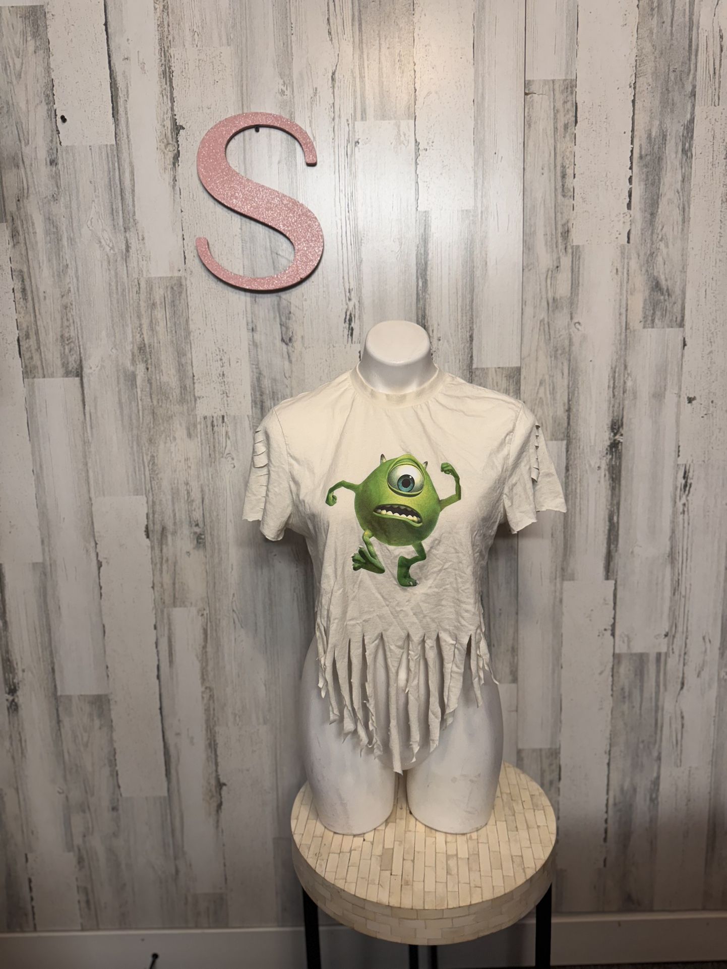 distressed or modified t-shirt featuring Mike Wazowski from Disney's Monsters, INC