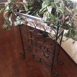 Wine rack with a basket are artificial flowers