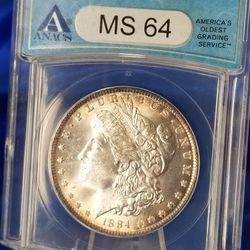 1884-O MORGAN SILVER DOLLAR (TONED MS64)