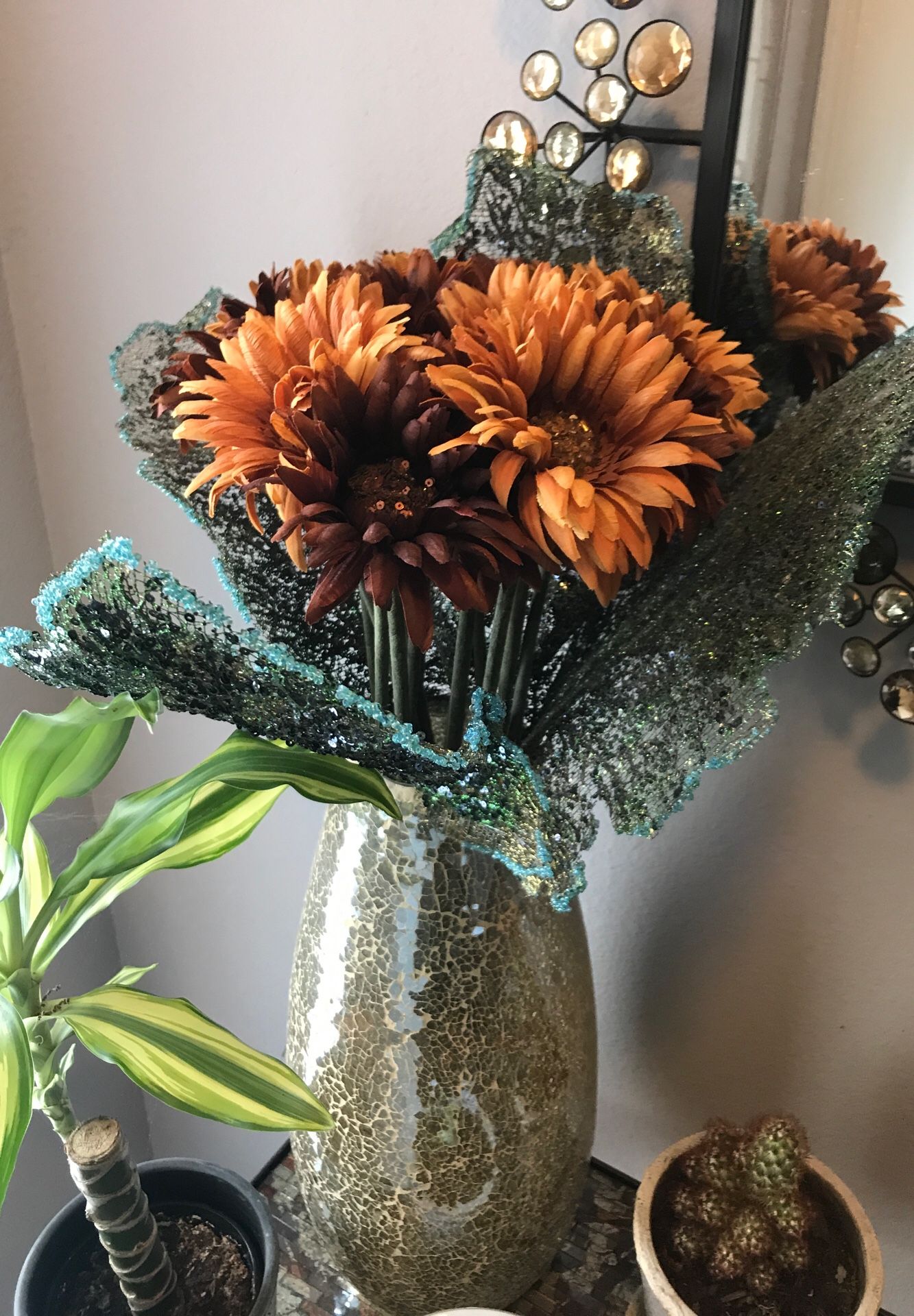 Mosaic glass vase and peacock flowers