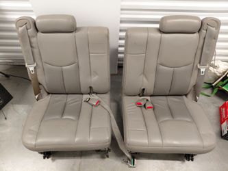 Gray leather 50/50 split third-row seats from a 2000–2006 Chevrolet Tahoe or GMC Yukon.