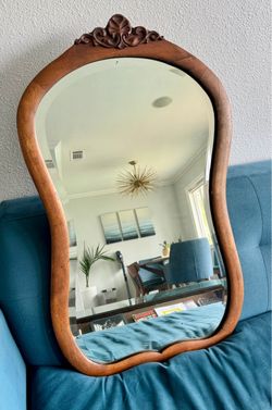 Hand carved wooden mirror