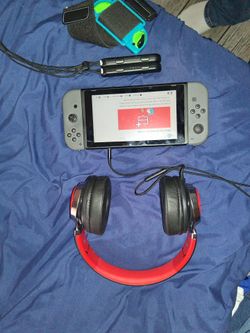 Nintendo switch system with joycons and charger plus extra screen protector.
