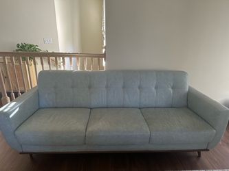 RoomsToGo Light Blue Leather Tufted Sofa