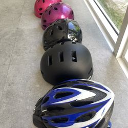 MANY BICYCLE HELMETS 