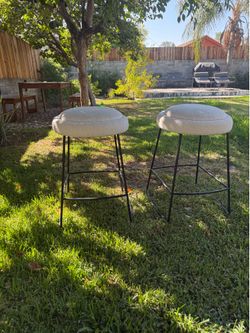 Pair of boucle + black metal counter stools