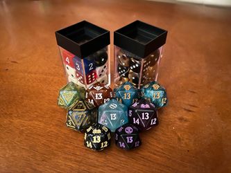 9 Magic The Gathering D20’s And Two 12-Packs Of 6-Sided Dice