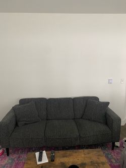 Dark gray sofa couch