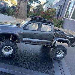 RC Element Toyota Tacoma Crawler. Comes with battery pack/remote control. Brand new Beadlock wheels and new proline tires and upgrades  Asking $375 OB