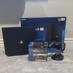 PS4 Pro- 1Tb, Controller Charging Stand, 10 Games  (Call of Duty ww2, Grand Theft Auto 5, Burnout Paradise, Assassins Creed)