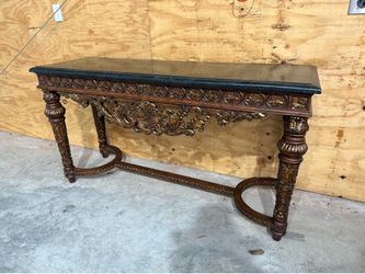 Console Table. Very Ornate. Has one flaw. Read the description. Entry Side Table. 5ft Long. 32” tall. 20” deep.  Only lower portion near the floor the