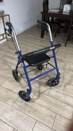 Four Wheeled Walker With Brakes
