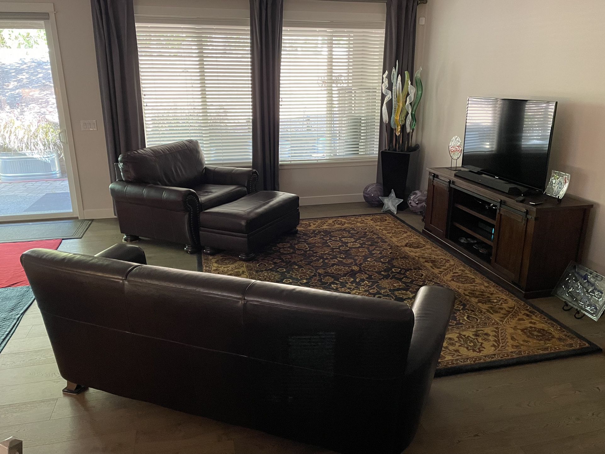 Leather Couch, Chair, Ottoman, And Rug