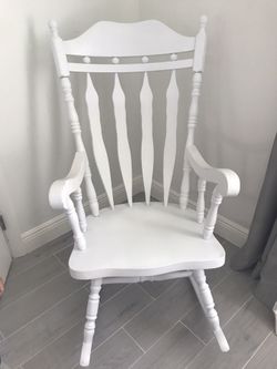 Solid wooden rocking chair.