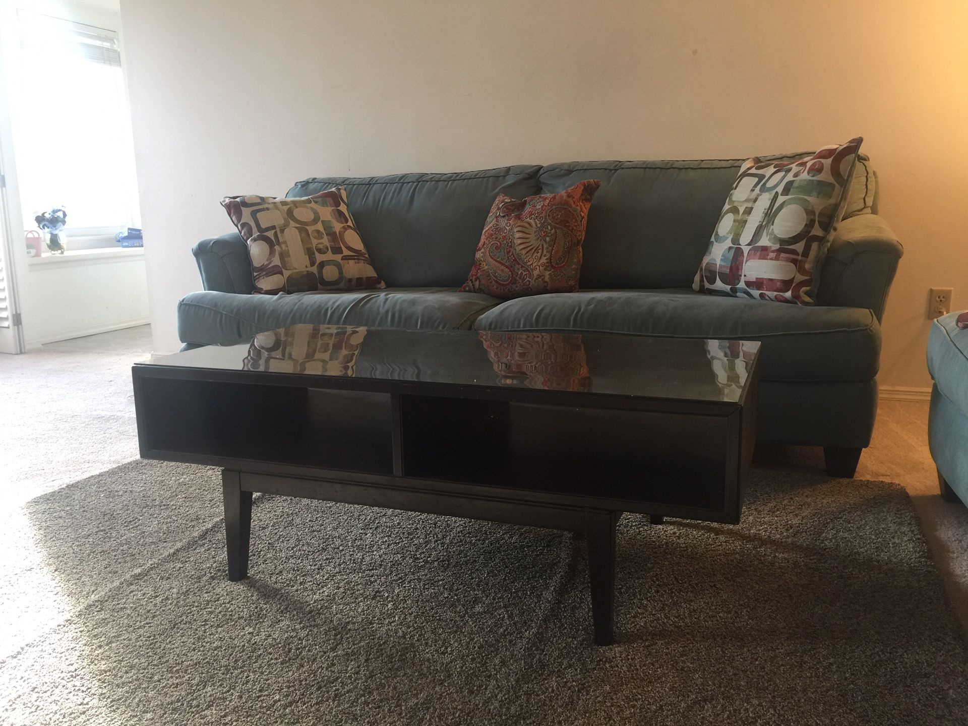 Two sofa, a coffee table, and blue rug.