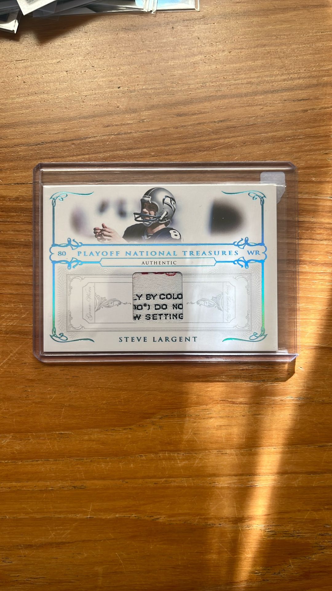 Steve Largent National Treasures Game Used Laundry Tag Patch /5