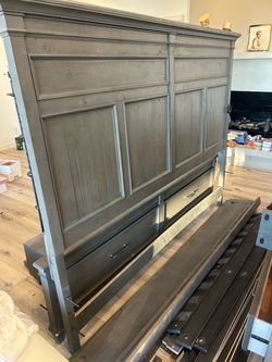 Gray bed frame with drawers