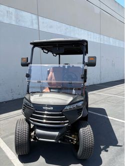 2026 Voyager Commander 4 Forward Non-Lifted 72-Volt Lithium Street Legal LSV Golf Cart in Matte Black w/All Saddle Brown Seats.
