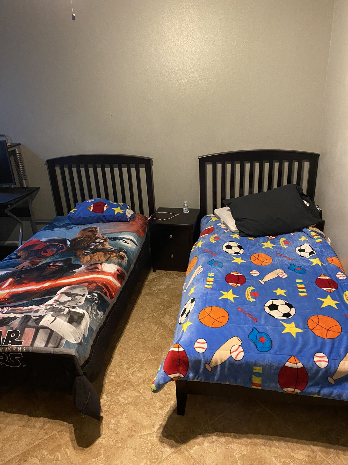 Twin beds with mattress and comforters