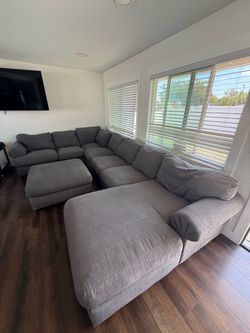 Living spaces grey couch with sectional