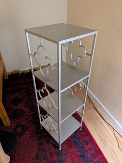 bohemian-style four-tier metal shelving unit 