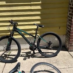 green and black mountain bike  