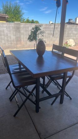 Solid wood table top/ metal legs  5’ L x 3’ W  2.5” Thick x 3’ Tall   4 chairs  $150