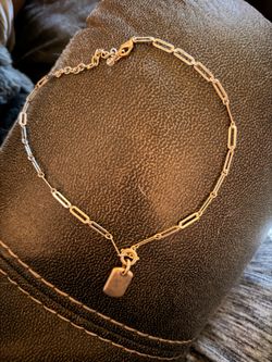Golden chain with tag charm