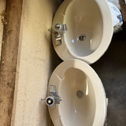 Two Bathroom Sinks With Faucets
