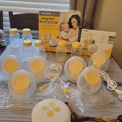 Medela Swing + Extra parts & FREE Diaperbag & 2PK Motif Storage Bags