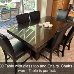 Table With Glass Top and Six Chairs