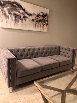 Gray Velvet Tufted Chesterfield Sofa and gold coffee table