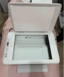 HP DeskJet 2752e printer/scanner with photo paper.