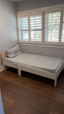 White ikea convertible twin bed.