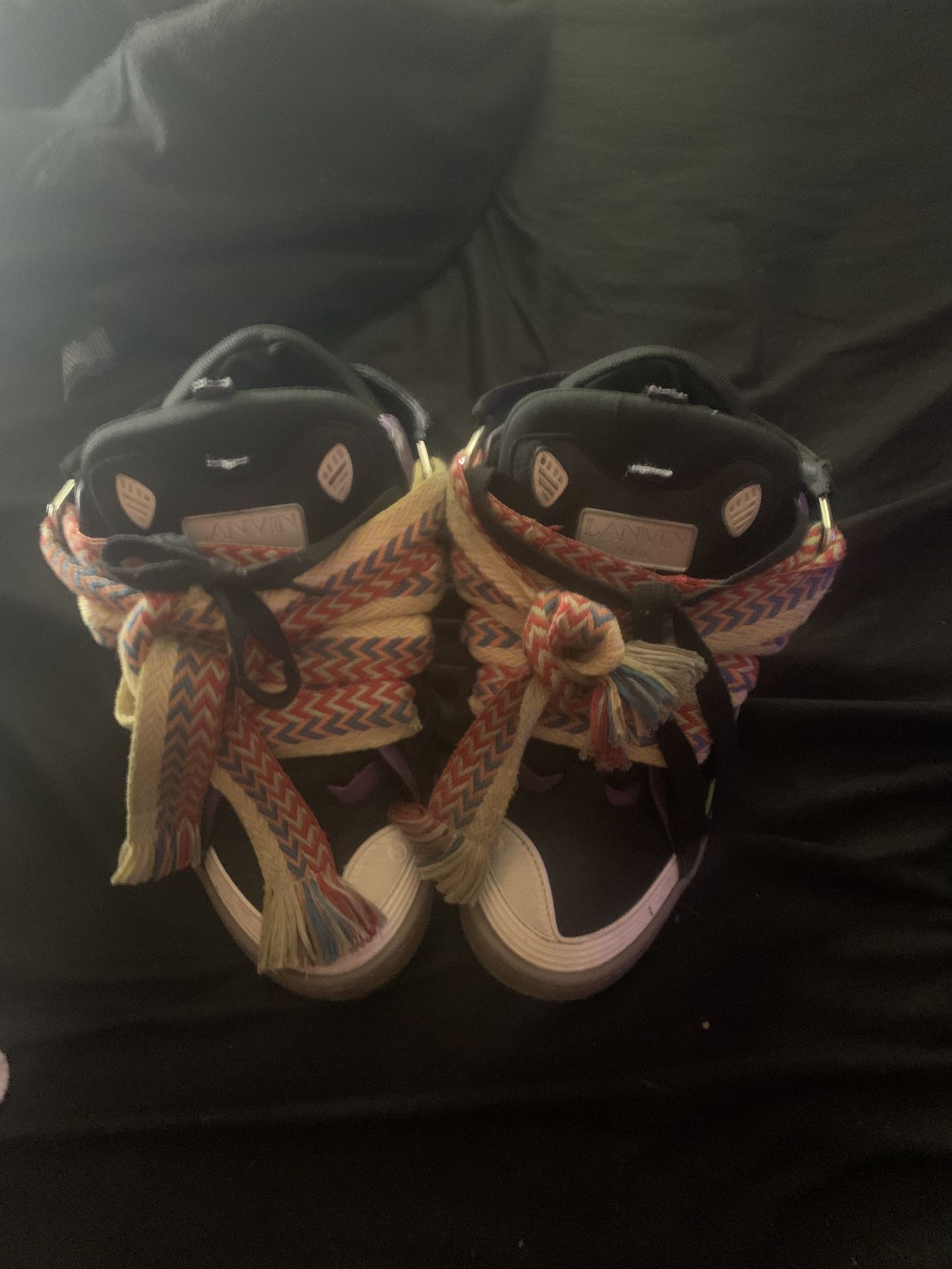 lanvins the strap on the tongue i cut it off because my brother drawed sharpie on it