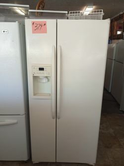 GE Side by Side Refrigerator off white excellent . Warranty . Delivery available . 2203 Fowler st. Ft. Myers 33901