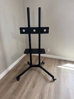 Mobile rolling TV stand cart with a device shelf and locking wheels