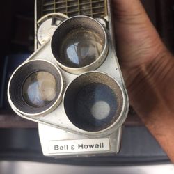 Old antique camera and tripods.