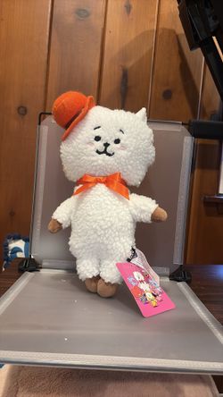 Defected BK7552 14” BT21 RJ standing plush doll dressed in a signature orange hat and bow tie.