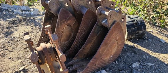 Excavator Buckets and Compactor Wheel